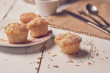 muffins with sugary chips and coffee