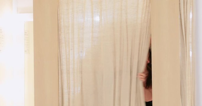 Two girlfriends fooling around in fitting room