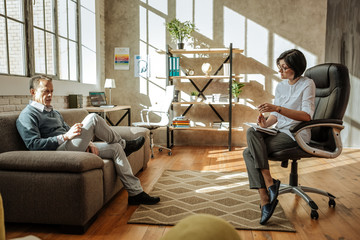 Dark-haired woman with bob haircut and her tidy client having conversation