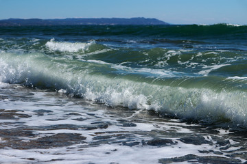 Freshness of the sea wave on a sunny day in Greece