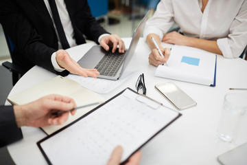 High angle closeup of unrecognizable business people discussing deal during meeting, copy space