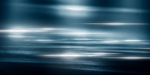 Wet asphalt, reflection of neon lights, a searchlight, smoke. Abstract light in a dark empty street with smoke, smog. Dark background scene of empty street, night view, night city.