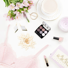 Feminine flat lay with women fashion accessories, lingerie, jewelry, cosmetics, coffee and flowers. Top view