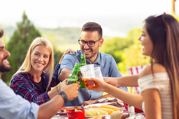 People drinking beer at barbecue party