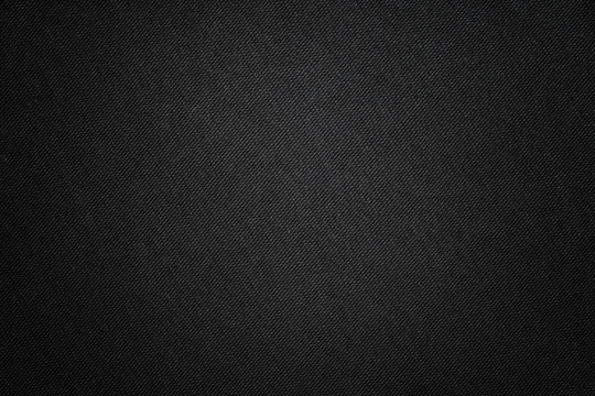 Black fabric texture. Textile background with vignette