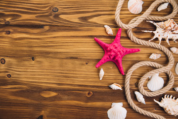 Summer time sea vacation background with star fish, marine rope and copy space