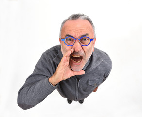man putting a hand in mouth and is screaming on white background