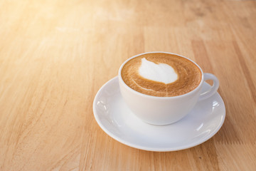 Cup of latte coffee on the table