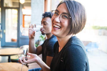 young couple laughing in cafe