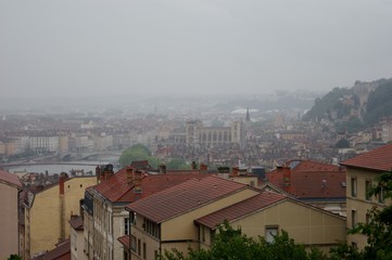 rooftops and view of the city on a rainy day, sunset in Lyon France