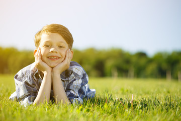 Young boy relaxing outdoors at the park