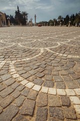 Fototapeta premium Cobbles on the square close-up. View in front of the mausoleum of Habib Bourguiba, Monastir, Tunisia, North Africa