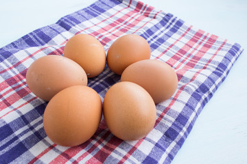 Organic eggs of natural color. Fresh eggs from a private producer on the kitchen table.