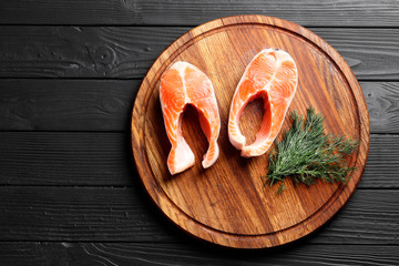 Cut fresh salmon on a wooden table