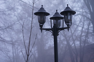 old street lamp on background of blue sky