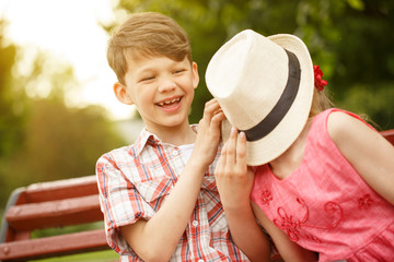 Happy little kids having fun outdoors at the park