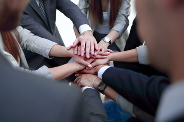 Fototapeta premium Close-Up of hands business team showing unity with putting their hands together.