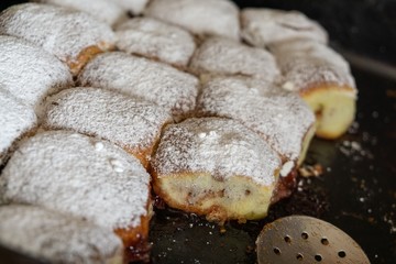 Baked stuffed cakes with marmalade and sugar. Home made. Slovakia