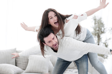 loving couple having fun in the living room .