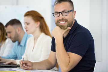 Businessman in a meeting with his colleagues at the office