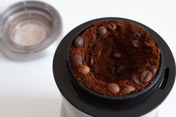 natural coffee in a coffee grinder