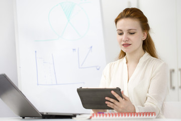 Businesswoman working at her office