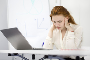 Businesswoman working at her office