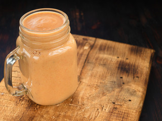 Pumpkin Smoothie. Healthy blended juice on rustic wooden table