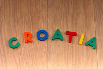 The word CROATIA is laid out from colored plastic letters