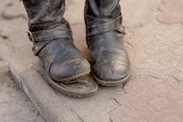 dirty torn old boots