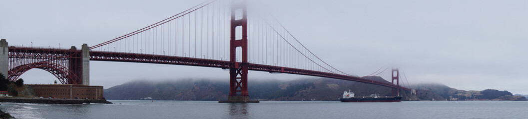 golden gate bridge covered in clouds