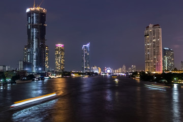 Obraz premium Cityscape, Panorama At Night Of Bangkok Side by Side Riverside, Chao Phraya Beautiful Color light ,of Thailand 2019