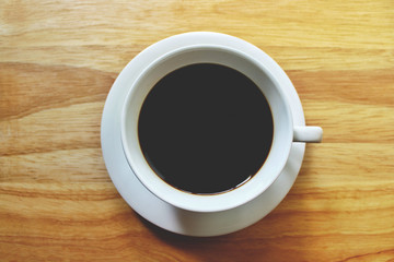 Close up top view white coffee cup No smoke on wooden background in studio