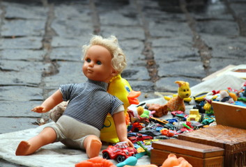 An old doll in the flea market