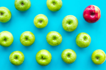summer food with apples on blue background top view pattern
