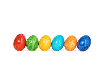 Different decorative Easter eggs in a row isolated on white background