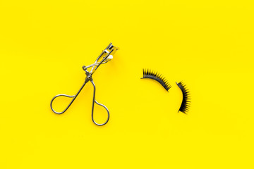 make up set with woman decorative cosmetic on yellow background top view