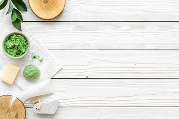 homemade spa with woman cosmetics on white wooden background top view copyspace