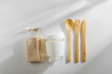 Eco friendly bamboo cutlery set and reusable coffee mug. Zero waste, plastic free concept.
