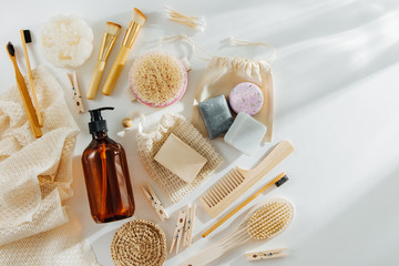 Set of Eco cosmetics products and tools. Soap, Shampoo Bottles, bamboo toothbrush, natural wooden brush. Zero waste, Plastic free. Sustainable lifestyle concept.