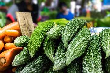 Bitter gourd (Karavila) for sale at a market.