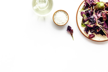 organic food pattern with green and red salads mix and oil white background top view space for text