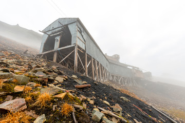 Fog surrounds the old Ruins of old coal mine Nr. 2 near Longyearbyen - Svalbard, Norway
