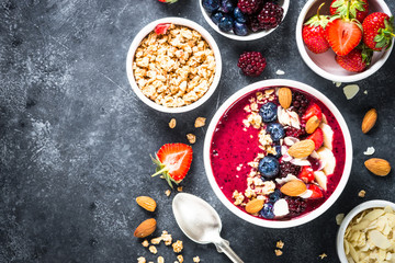 Obraz na płótnie Canvas Smoothie bowl from fresh berries, nuts and granola.