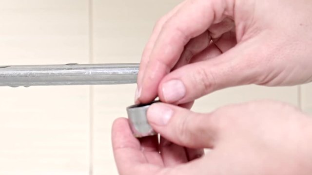 Woman handyman replace tap aerator, hands of a plumber close-up