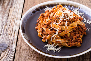 Fettuccine pasta with bolognese sauce and thyme