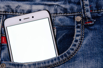 White smartphone in a white screen jeans pocket