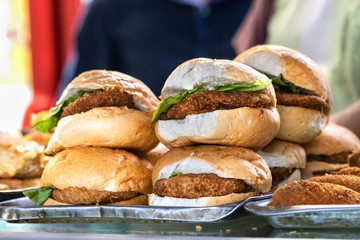 Group of chiken burger with lettuce for sale outdoors at the city center of Port Louis, Mauritius