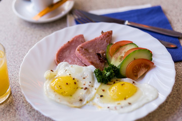 scrambled eggs with vegetables and sausage with coffee