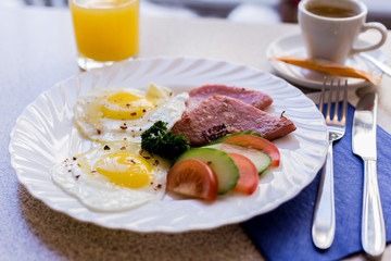 scrambled eggs with vegetables and sausage with coffee